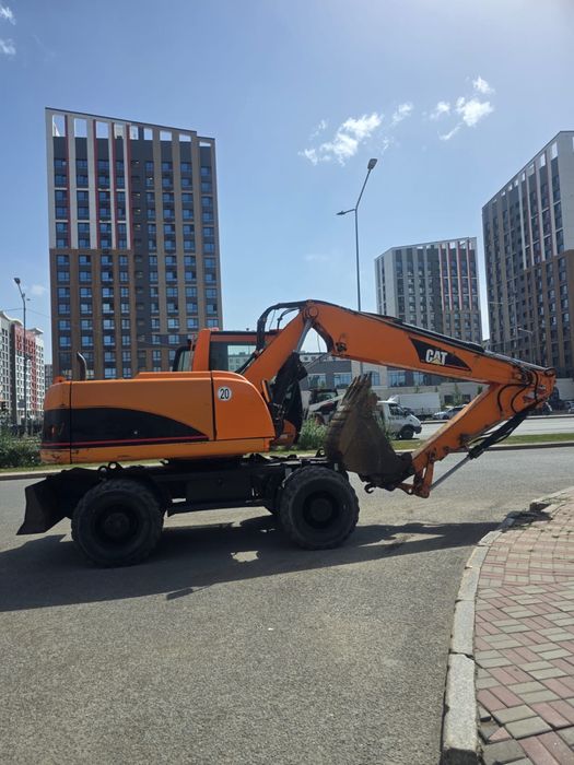 Продаётся колесный экскаватор CAT