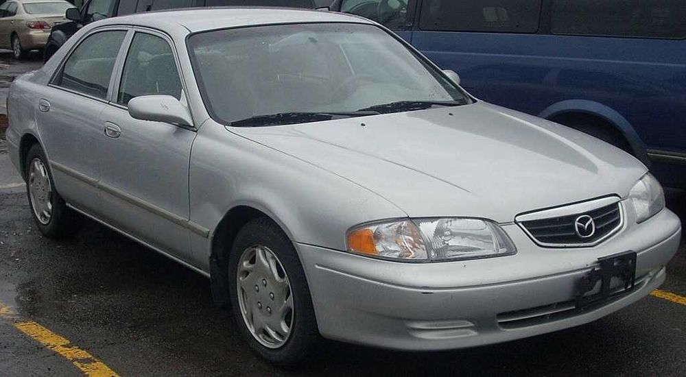 Крыло на Мазда 626 98-/Mazda 626 -99