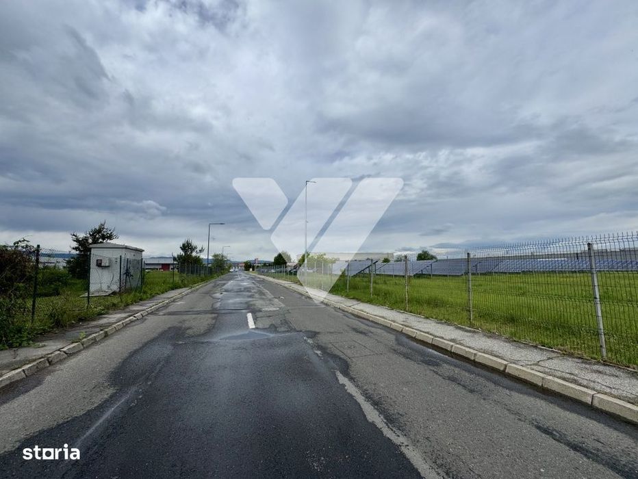 Teren intravilan industrial 11.059 mp, PUZ aprobat, asfalt - zona Vest