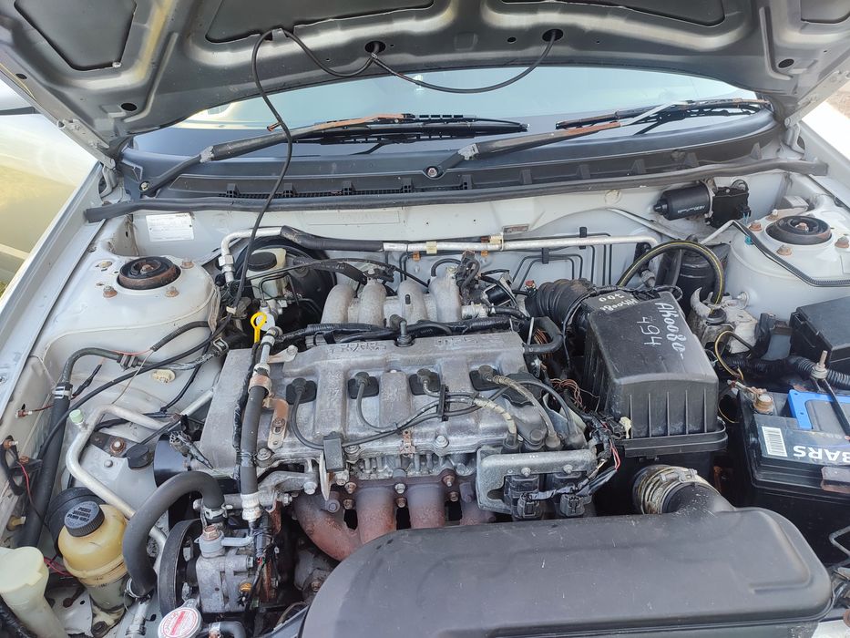 Легковая автомобил Мазда птичка