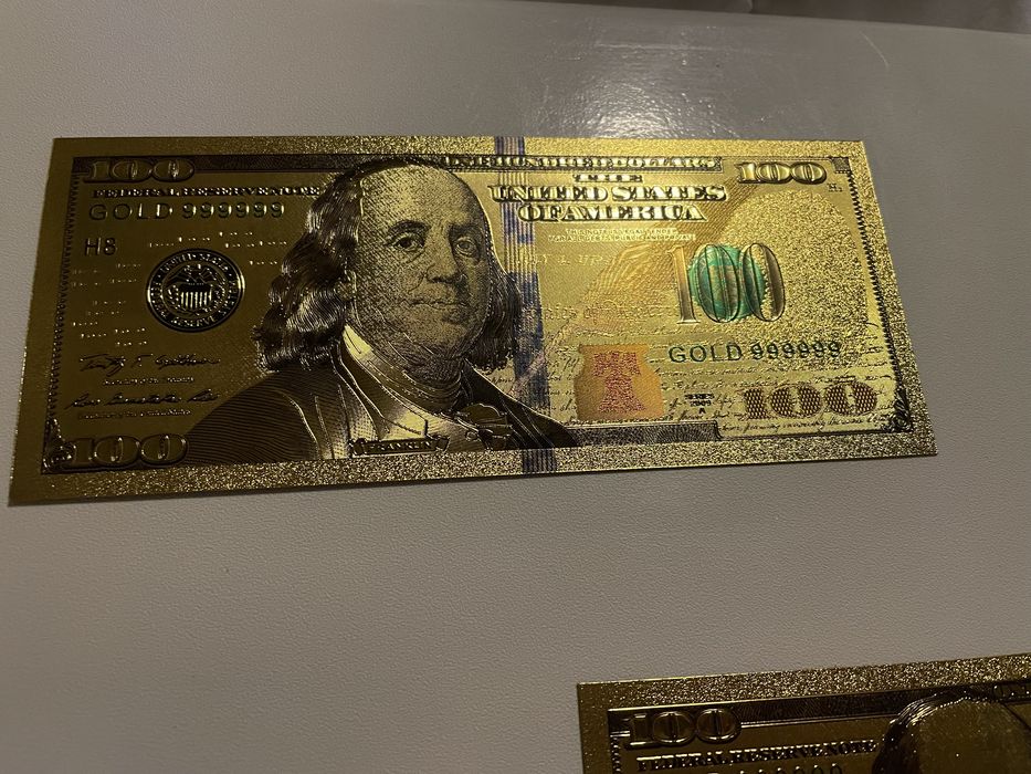 Bancnote 100 dolari aurite