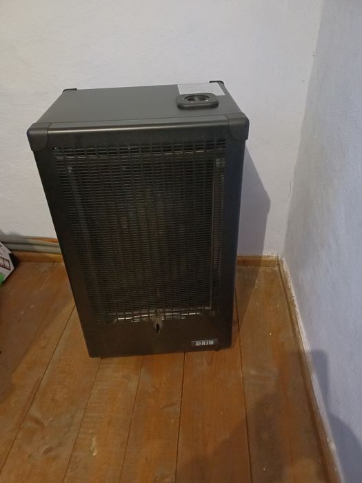 Soba de incalzit , pe butelie butan,cu regulator,ceas