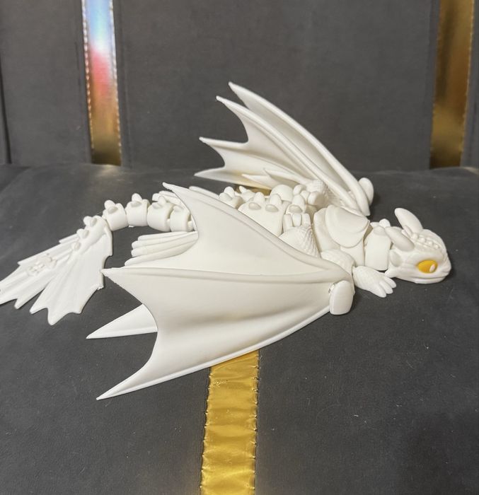 Подвижная игрушка дракон