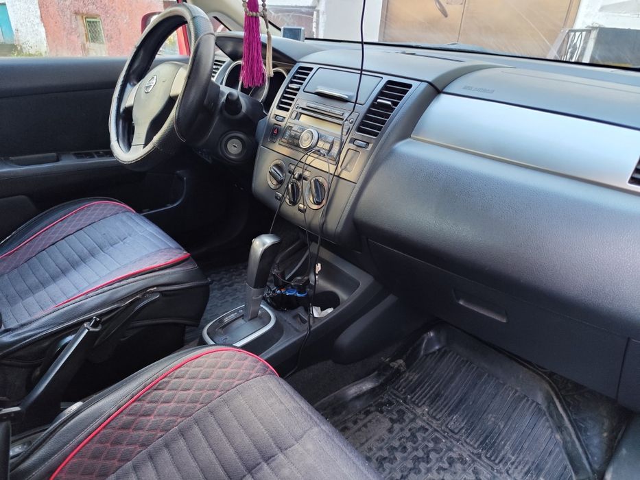 Ниссан      Тиида .