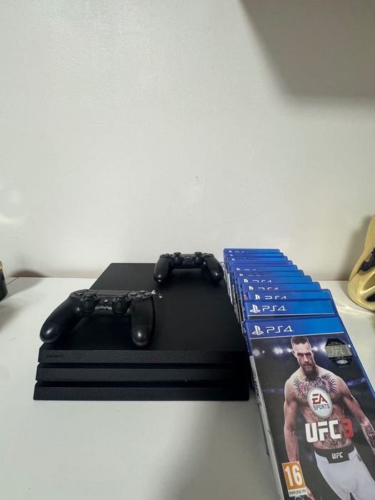 Vand Playstation 4 pro + 2 controllere +14 jocuri