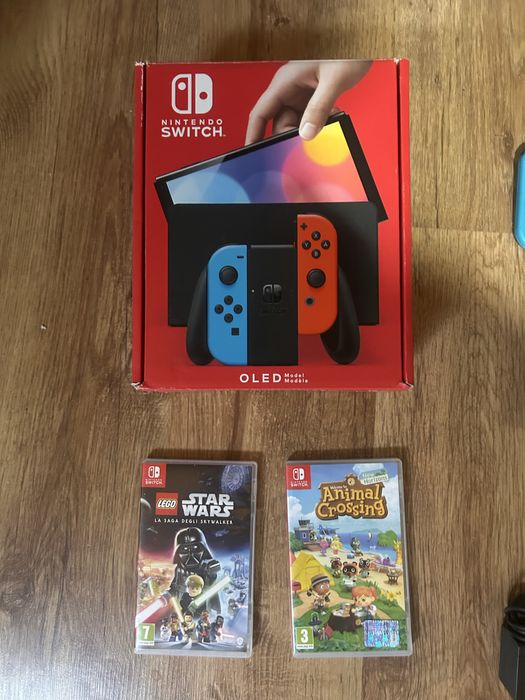Nintendo Switch OLED + 2 jocuri + cutie + accesorii