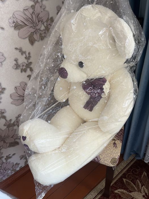 Мягкий игрушка белого цвета