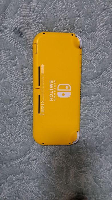 Продаю нинтендо свитч лайт + 5 игр