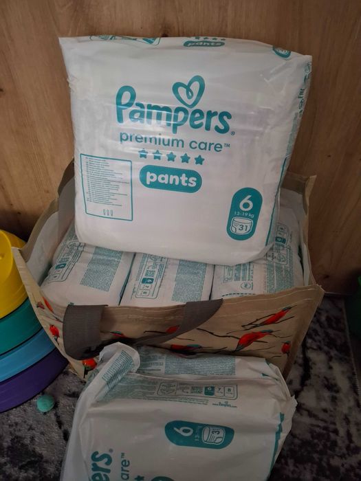 4 baxuri sigilate + 19 buc Scutece-Chilotel Pampers Premium Care Pants Nr. 6 (13-19 kg)