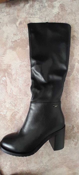 Продам новые сапоги