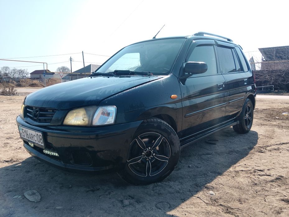 Мазда демио 2003 года