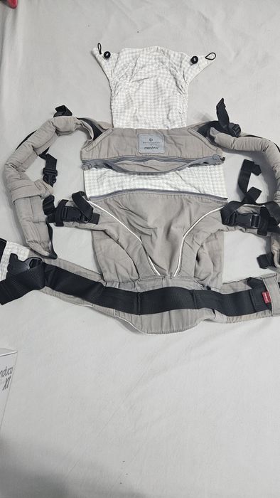 Sistem de purtare MANDUCA XT si protectie impermeabila