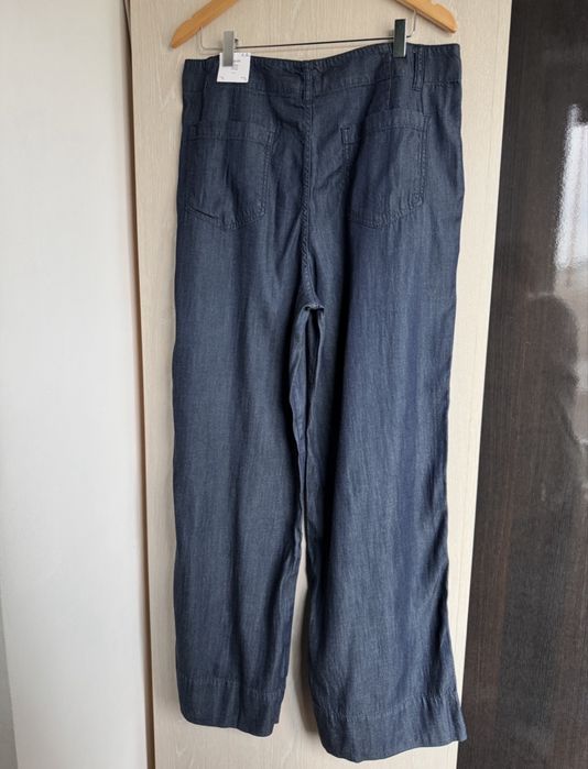 Pantaloni evazati aspect denim XL Mango