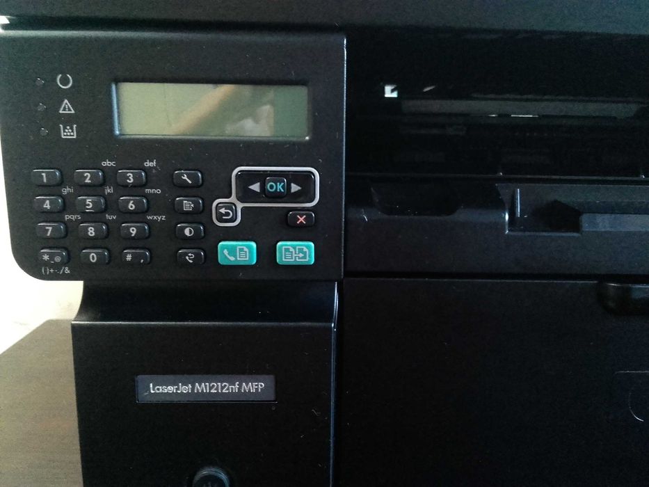 Като нов! Лазерен принтер,скенер и копир 3 в 1 HP LaserJet M1212nf MFP с мрежа и ADF