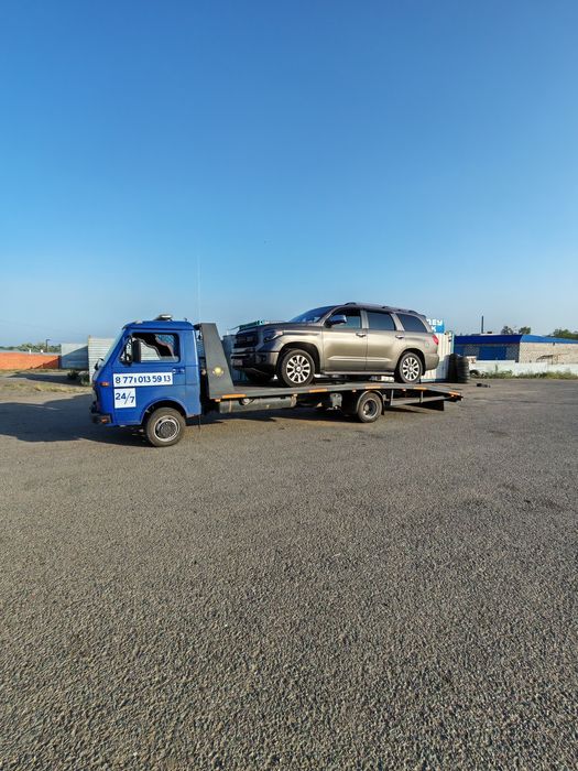 Услуги эвакуатора для спецтехники и авто