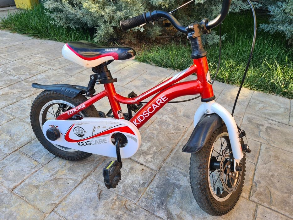 Bicicletă copii Kidscare 12 inch – stare foarte bună + roți ajutătoare