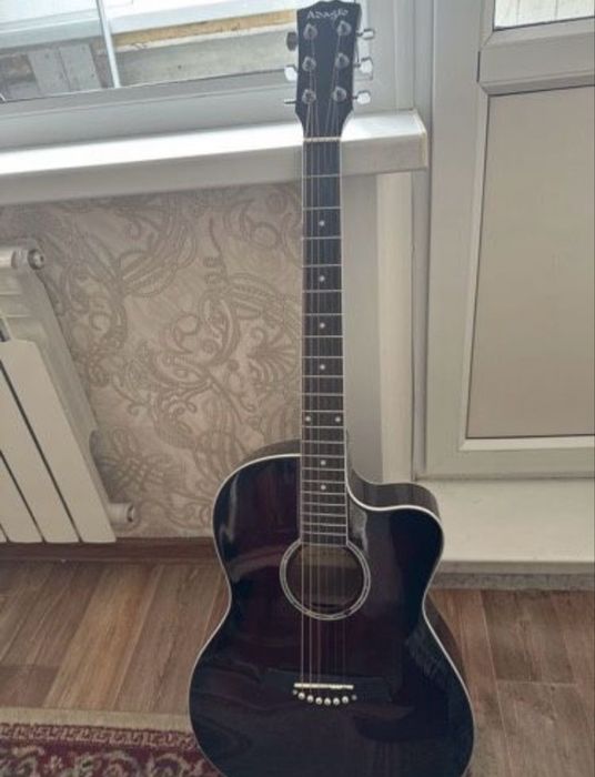 Гитара чехолымен царапина нету