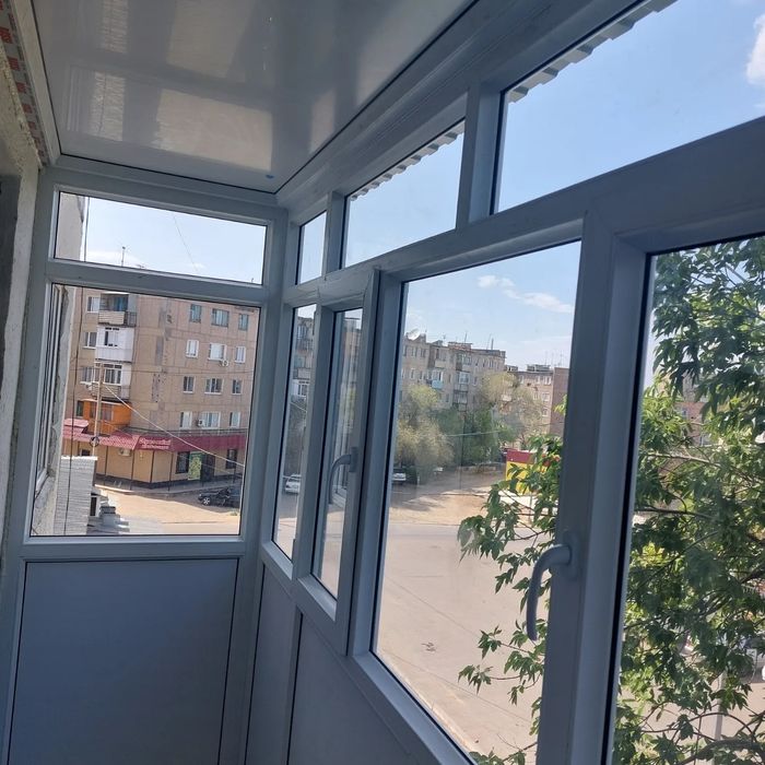 Пластиковые окна двери балконы