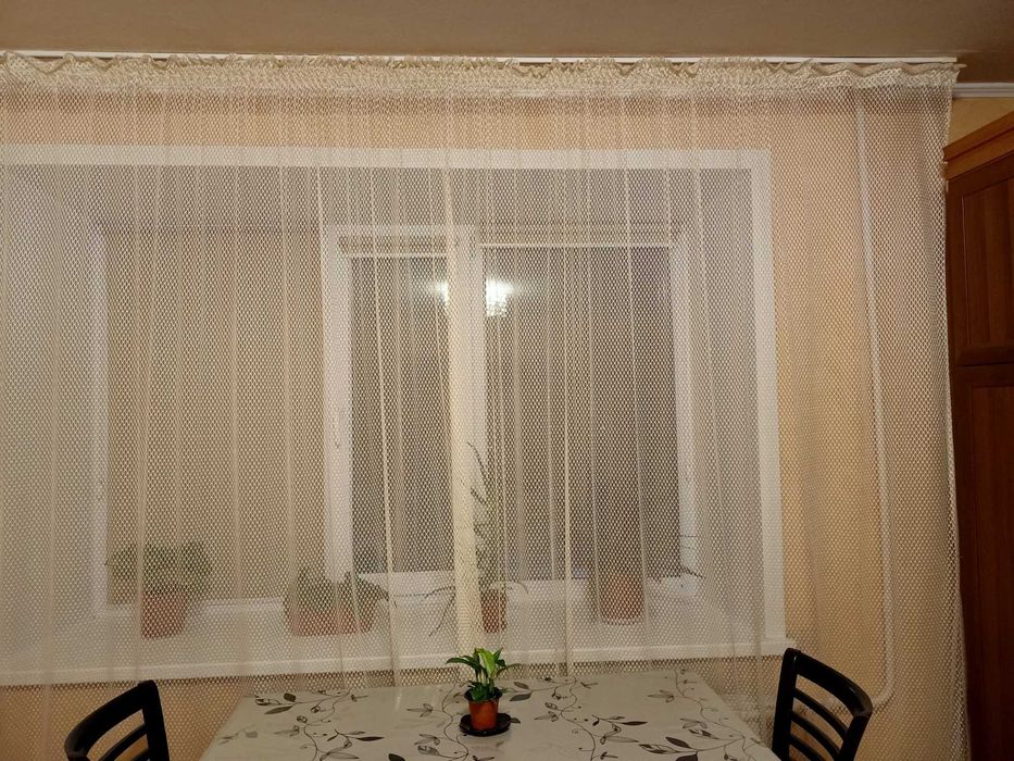 Продам кремовую тюль.