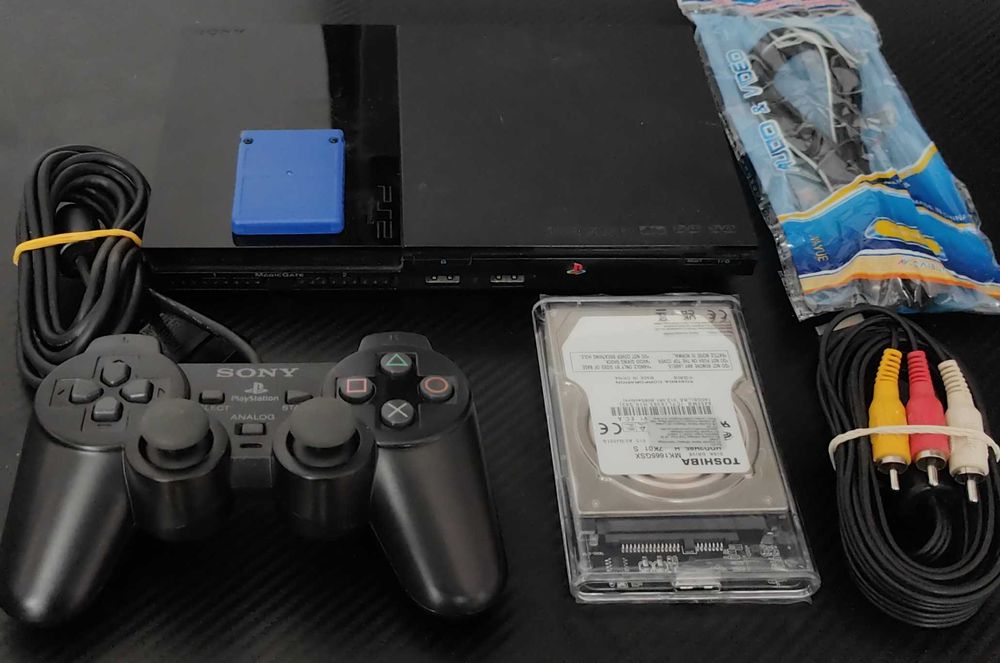 Playstation 2 model slim,modat, cu 33 jocuri de top ,maneta ,cabluri