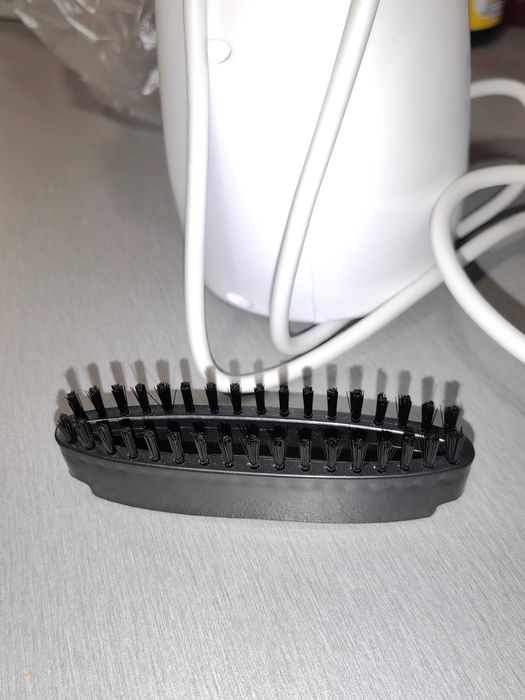 Уред за вертикално гладене на дрехи