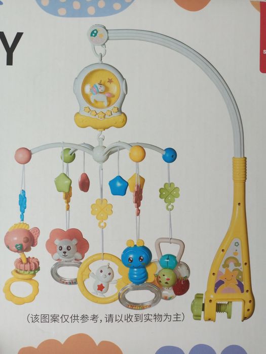 Продам музыкальную навесную погремушку