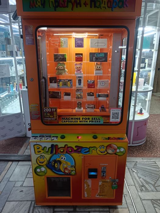 Вендинговый игровой  аппарат бульдозер