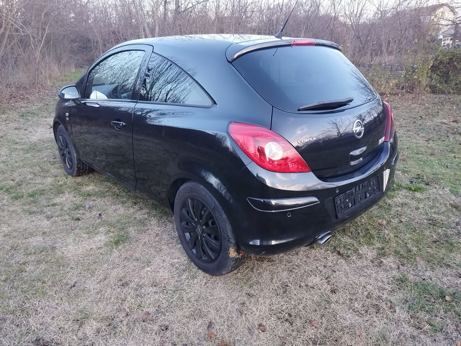 Opel Corsa 1.4i cu 87 cp,E5,an 2012,incalzire volan si scaune,AC