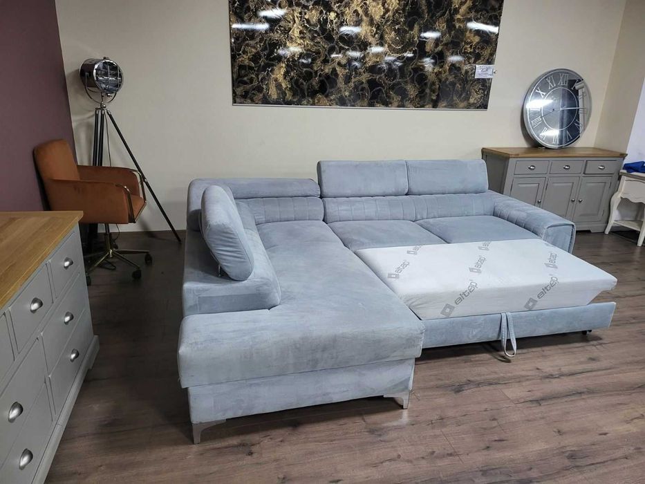 ПРОМОЦИЯ! Светло син ъглов диван от плат с функция сън и ракла
