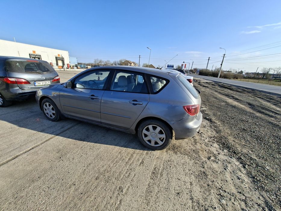 Mazda 3 , 1.4 Benzina , an2004 , 84cai