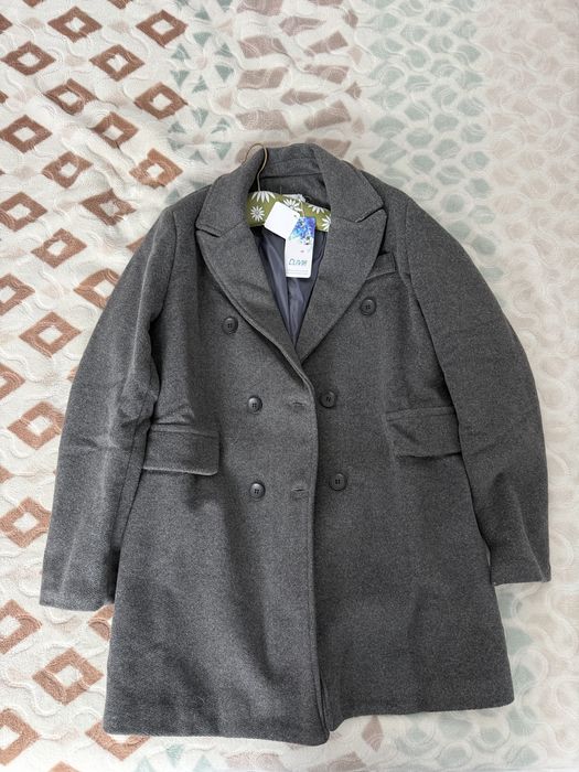 Palton nou ci eticheta