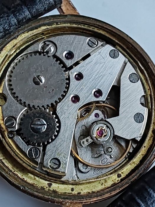 Ceas Herma Placat cu aur Int. Manuala Funcționează excelent!