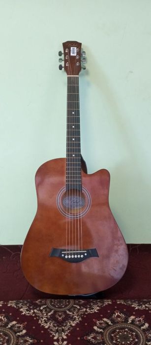 Gitara sotiladi holati zur chixoli bor