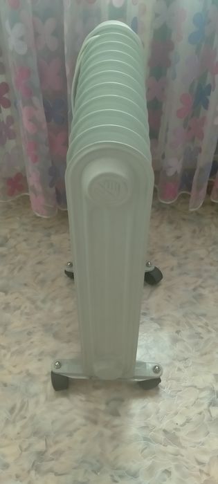 Обогреватель масляный Elenberg.