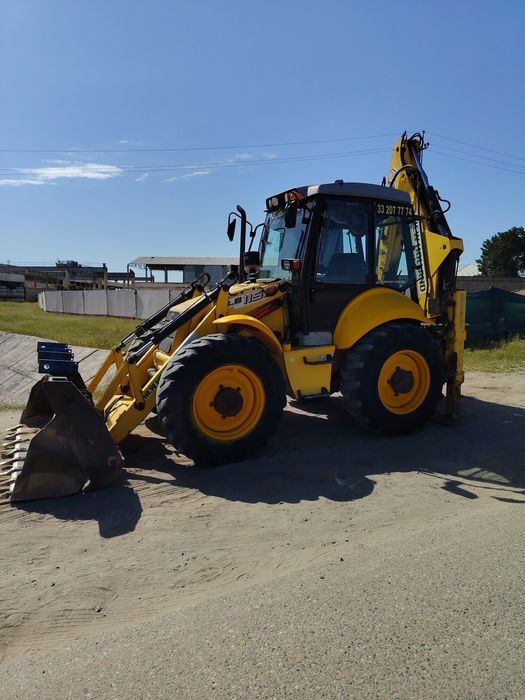 New Holland 115 Pagruzchik