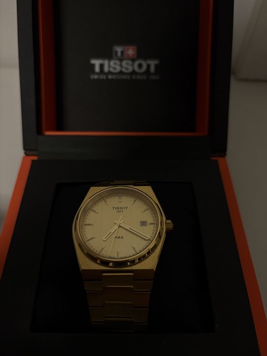 Tissot PRX Gold.