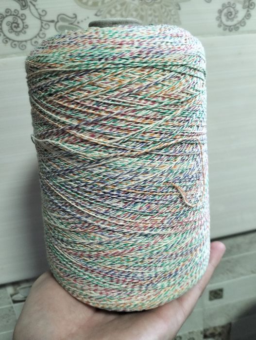 Пряжа в бобине .