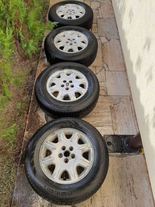 Set 4 roti aliaj 15" 5x100 originale Rover cu cauciucuri Nokian M+S