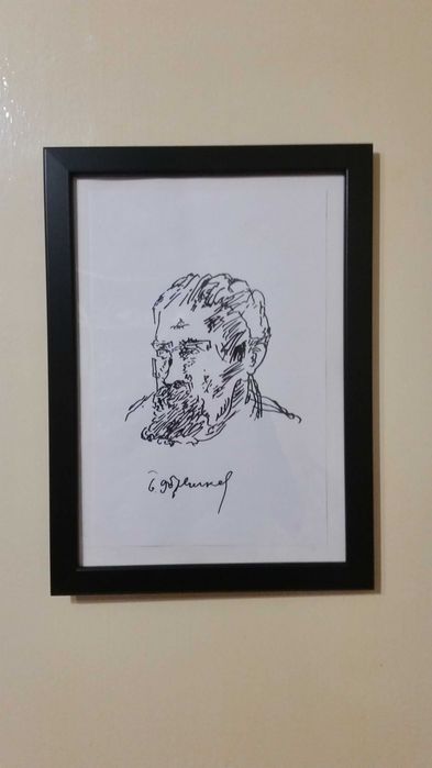 Черно бяла графика в рамка със стъкло отпред.