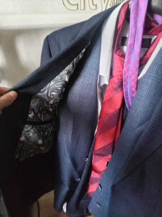 костюм новым состояние