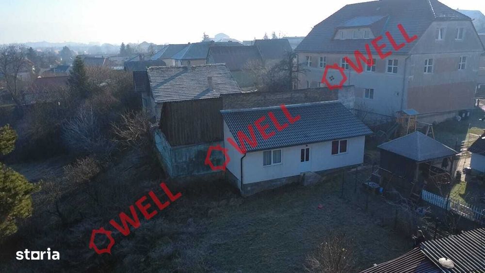 Casă din lemn de vânzare pe teren de 896 m²!