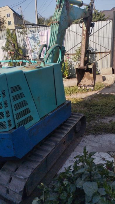 Японский миниэкскаватор Takeuchi TB