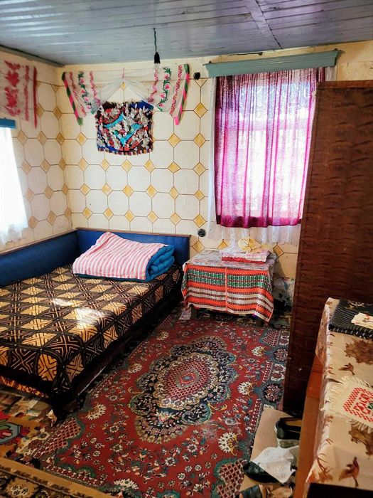 Casă caramida Radoiesti cu teren de 1.138 mp și deschidere la două străzi – 50.000 lei negociabil