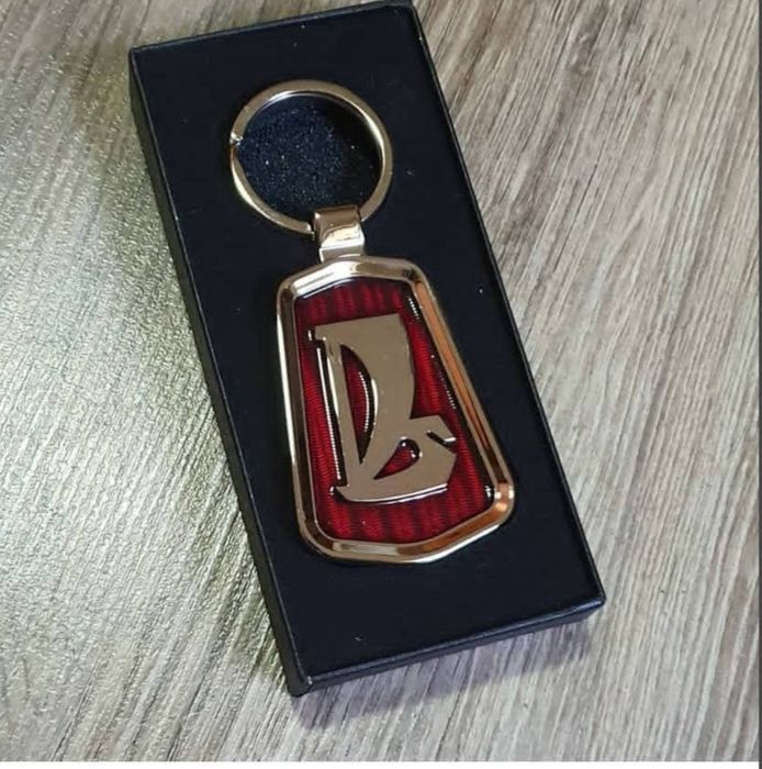 Брелоки в виде эмблем продам