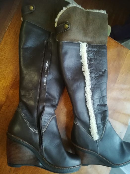 Новые кожаные сапоги