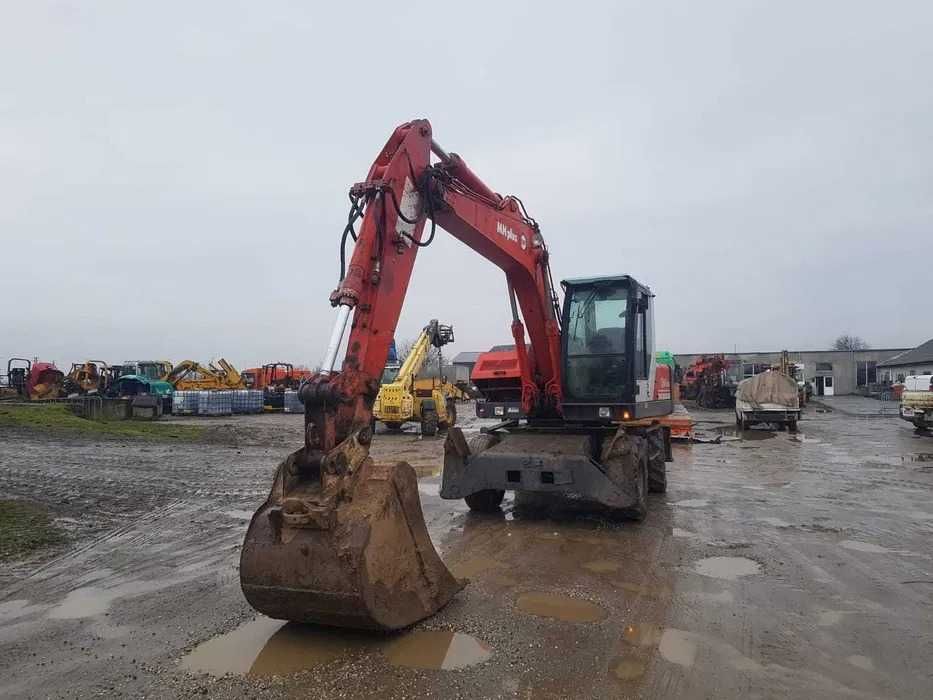 Dezmembrez excavator pe roti OK MH PLUS