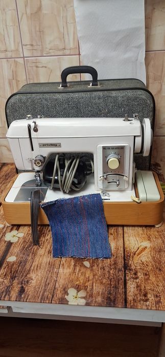 Masina de cusut privileag