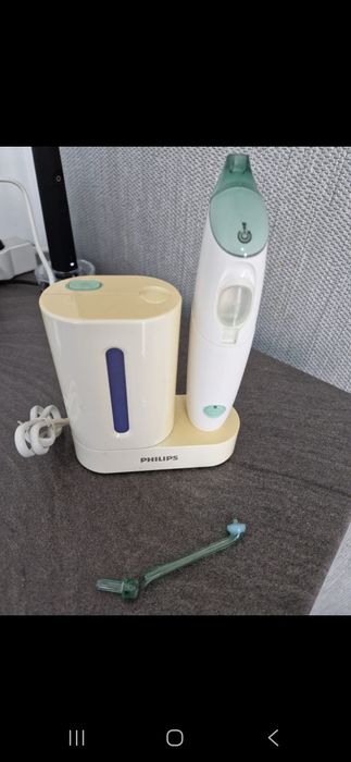 Dus bucal Philips si sterilizator capete periute de dinti