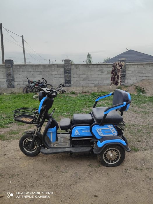 Трицикл скутер а