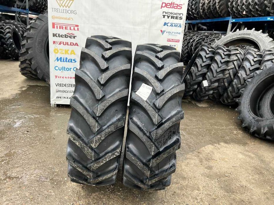 Cauciucuri noi 14.9-26 cu 10 pliuri marca OZKA pentru combina